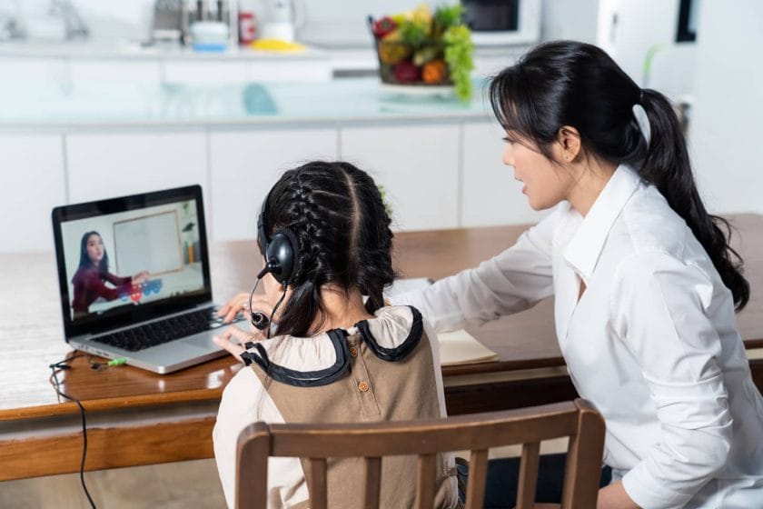 An image of an Asian girl learning online class from a teacher by digital remote internet due to coronavirus pandemic.