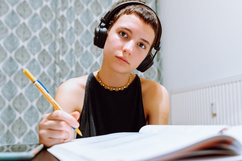 An image of a high school girl teenager Homeschooling and doing homework.